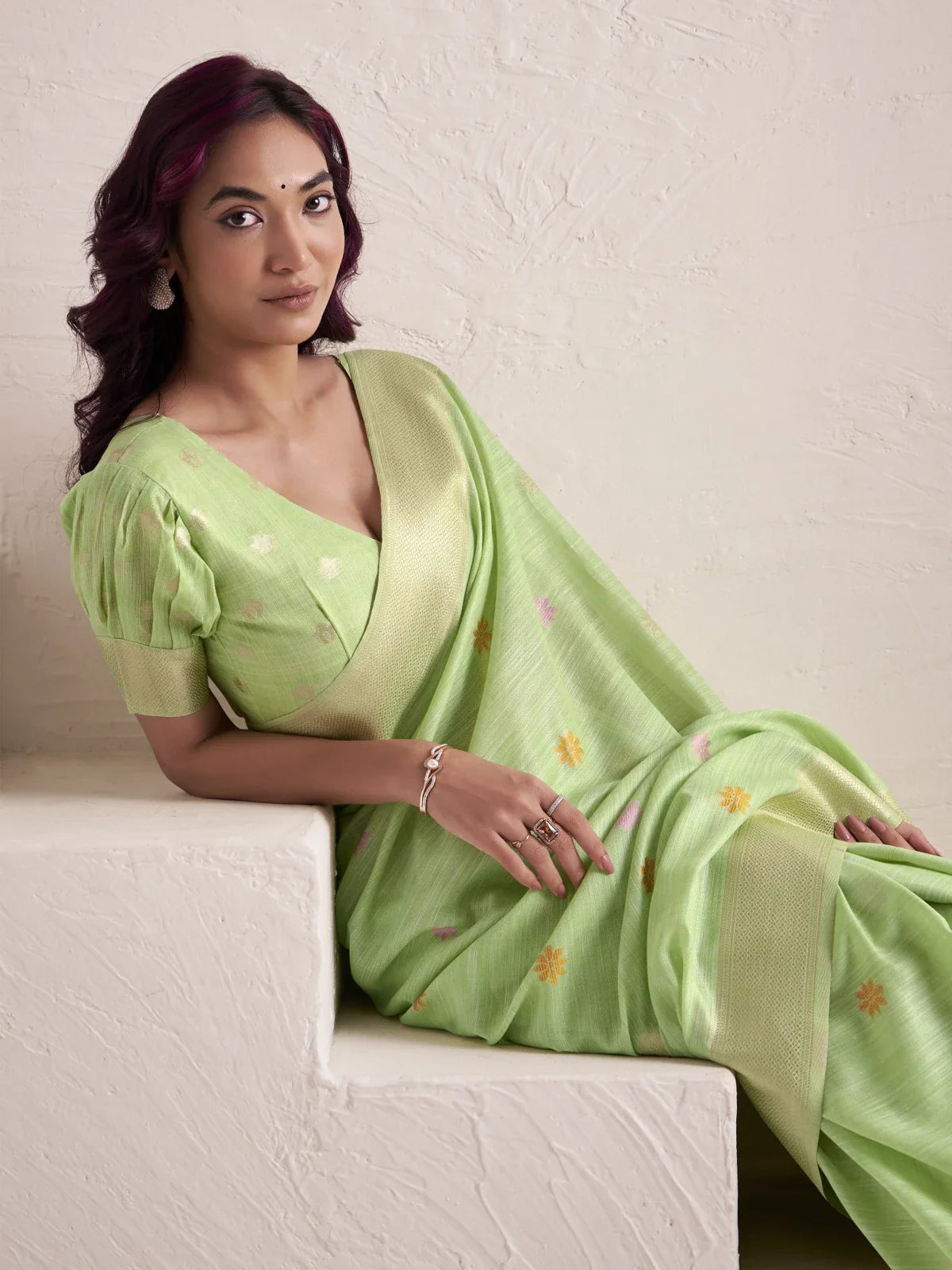 Tarani green linen saree upper body view showing elegant blouse and soft fabric texture