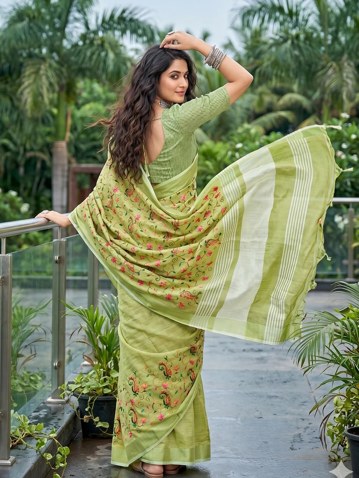 Tarani Hansika light green linen saree back view showing pallu and blouse design