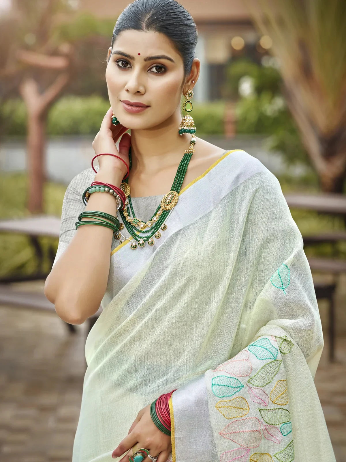 Tarani light green linen saree with pastel leaf motifs upper body view