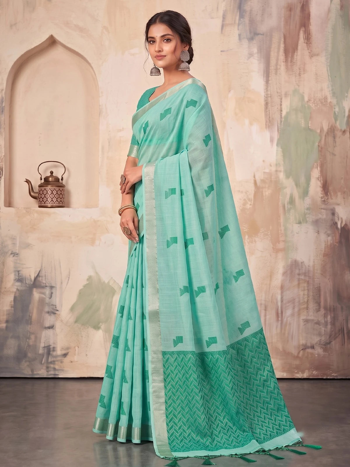 Tarani mint green linen cotton saree side view highlighting elegant drape and woven pallu