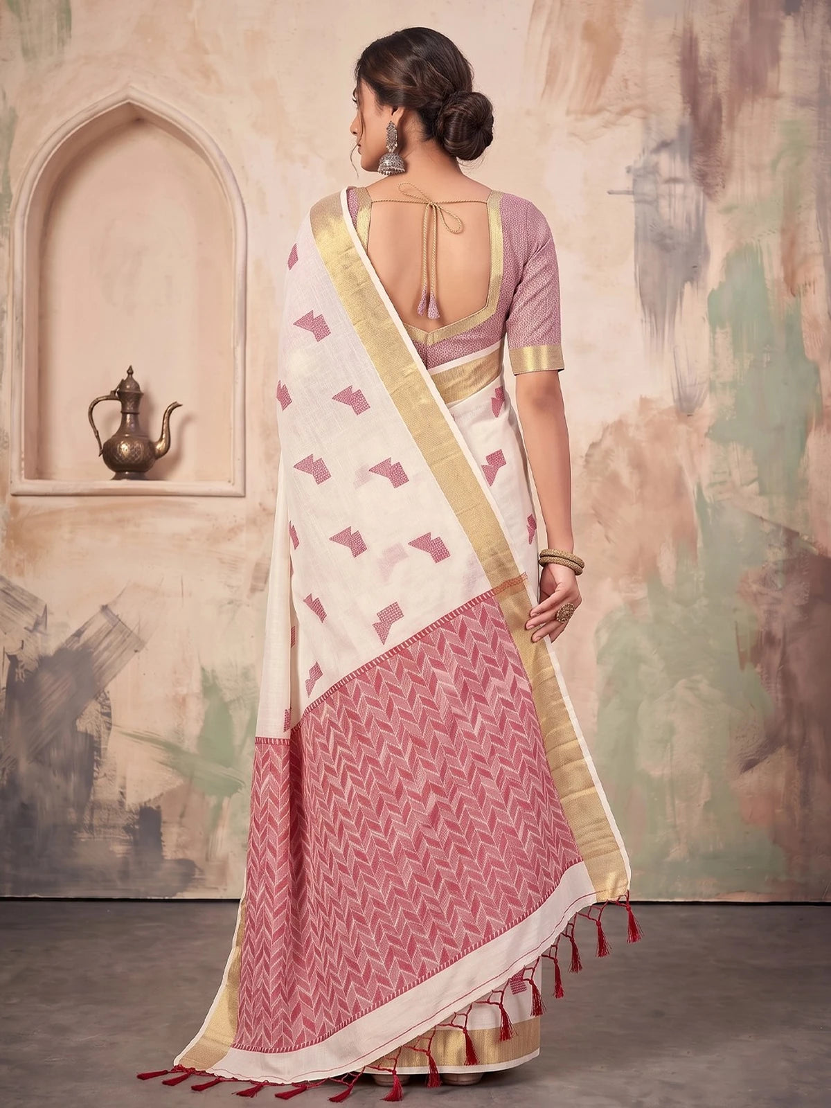 Tarani off white linen cotton saree back view with tassel pallu