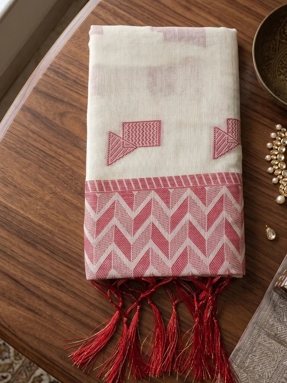 Tarani off white linen cotton saree with geometric woven work and tassels closeup view