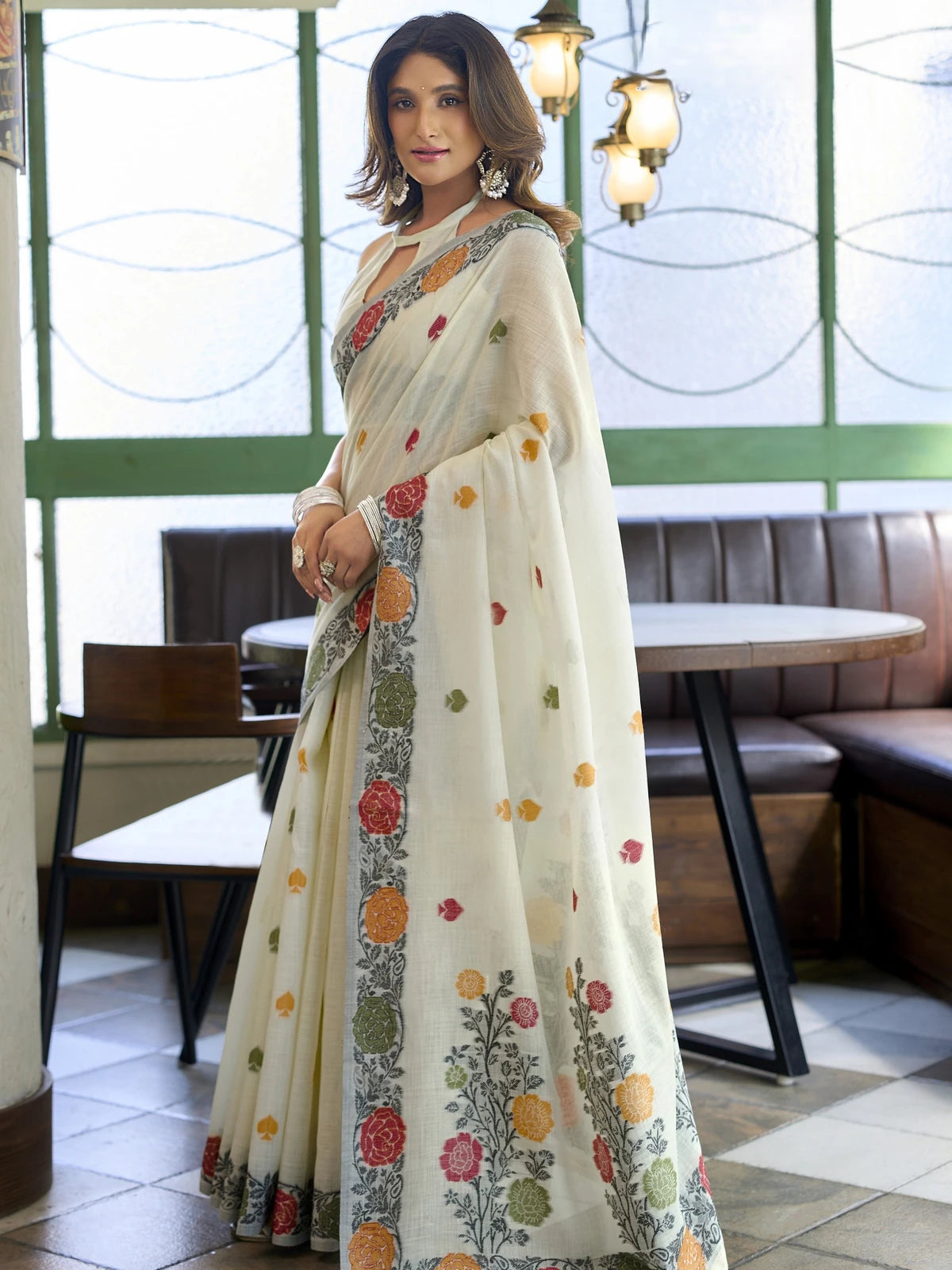Tarani off white linen jacquard saree side view with colourful floral woven pallu and border