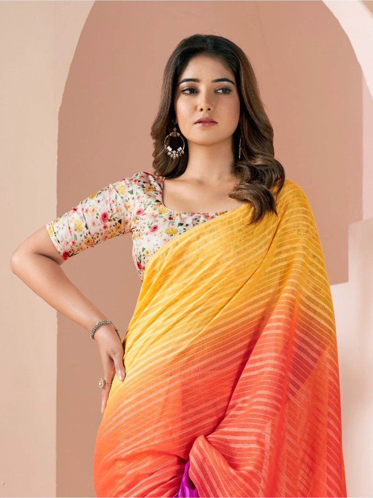 Tarani orange linen saree upper body view showing floral blouse and graceful drape