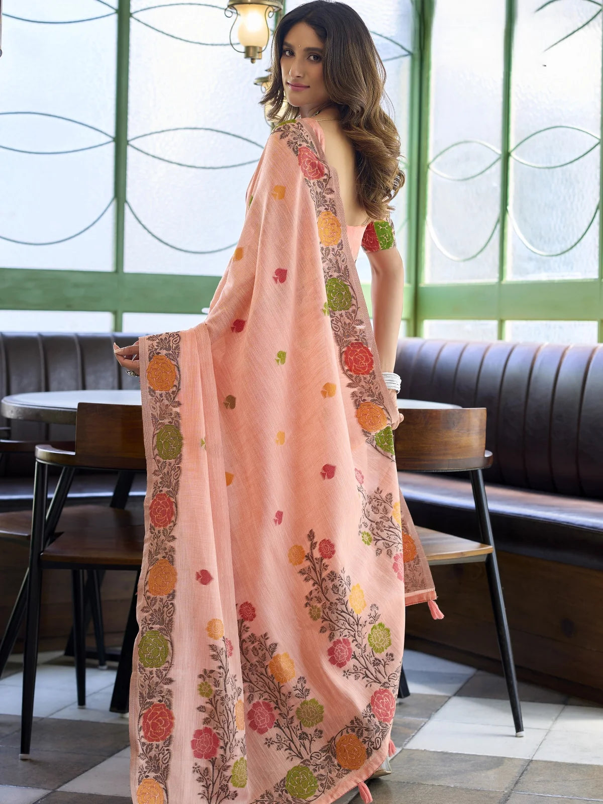 Tarani peach linen jacquard saree elegant back view with floral woven pallu