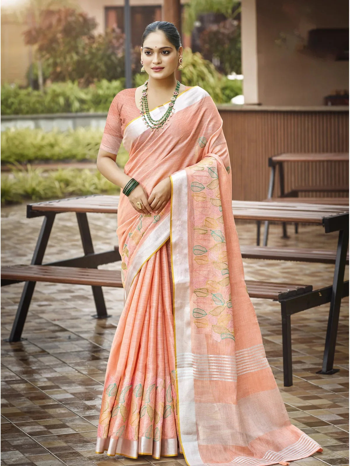 Tarani peach linen saree full view with woven leaf motifs and blouse piece