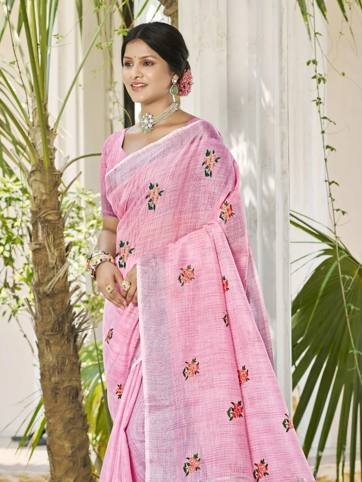 Tarani pink linen saree front pose highlighting embroidery details