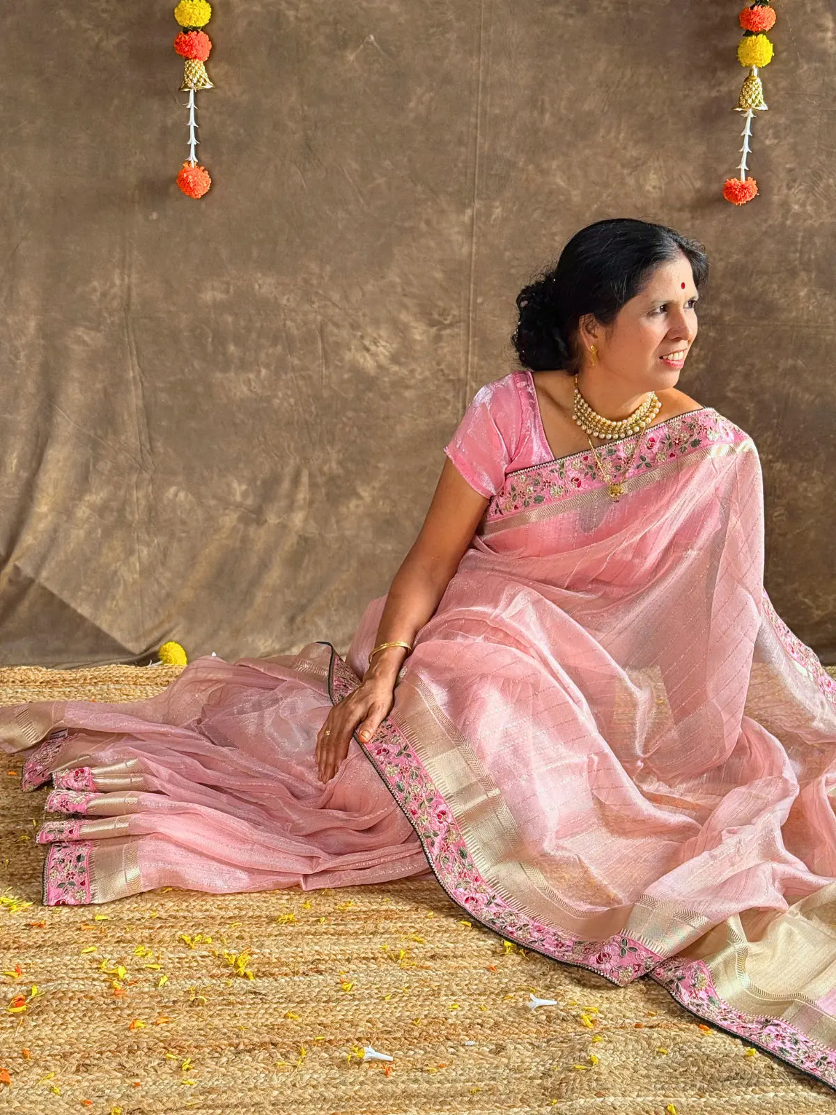 Tarani pink linen silk saree front sitting pose view