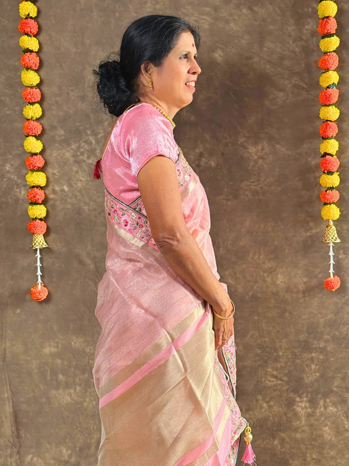 Tarani pink linen silk saree side profile view