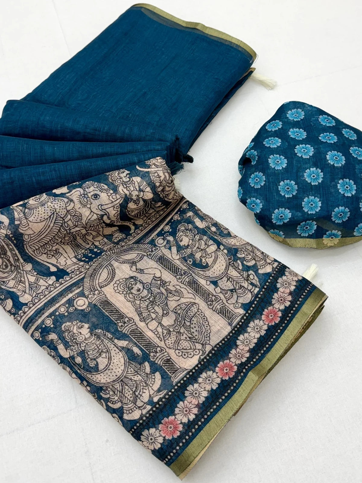 Tarani teal linen saree fabric and border closeup with blouse