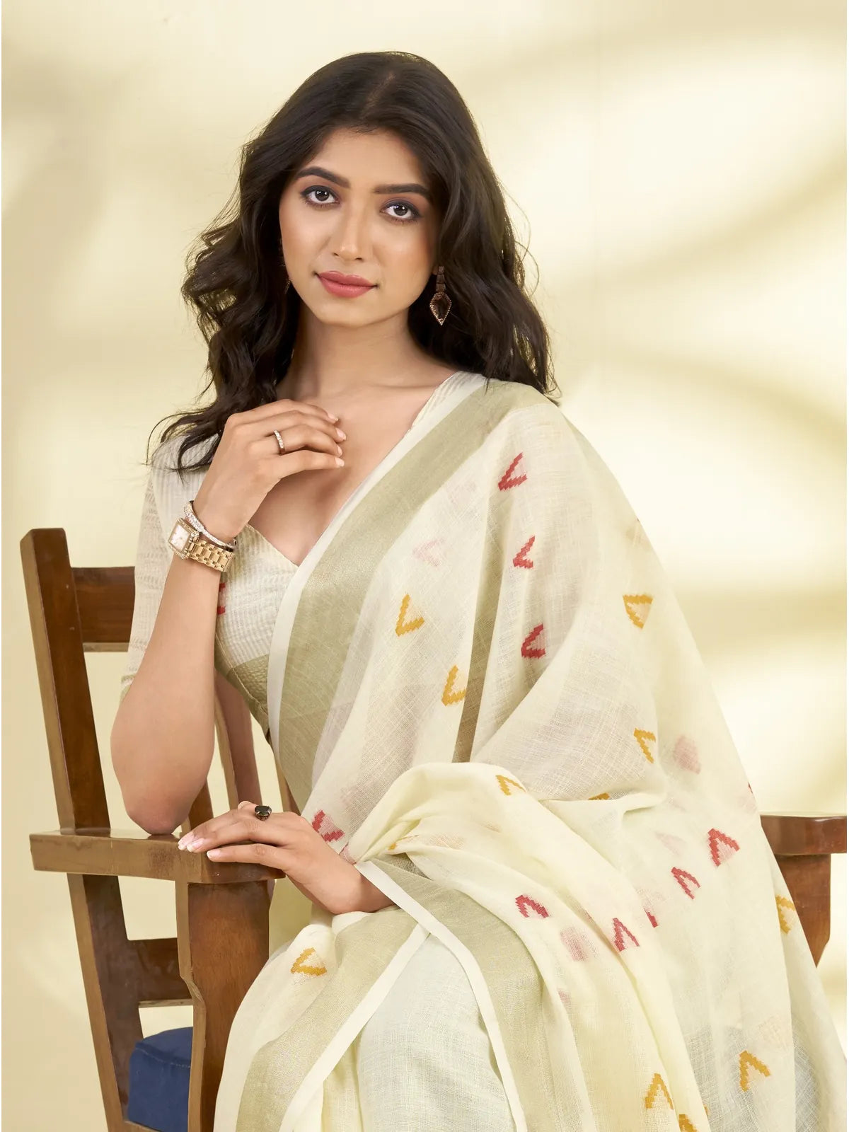 Tarani lightweight linen saree in white shade with zari detailing front sitting view for daily elegance