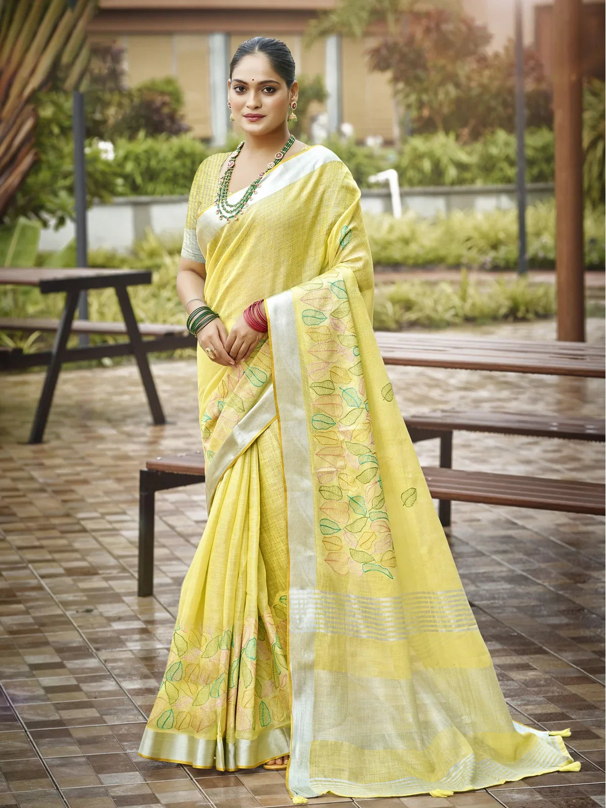 Tarani yellow linen saree full view with delicate leaf embroidery and blouse