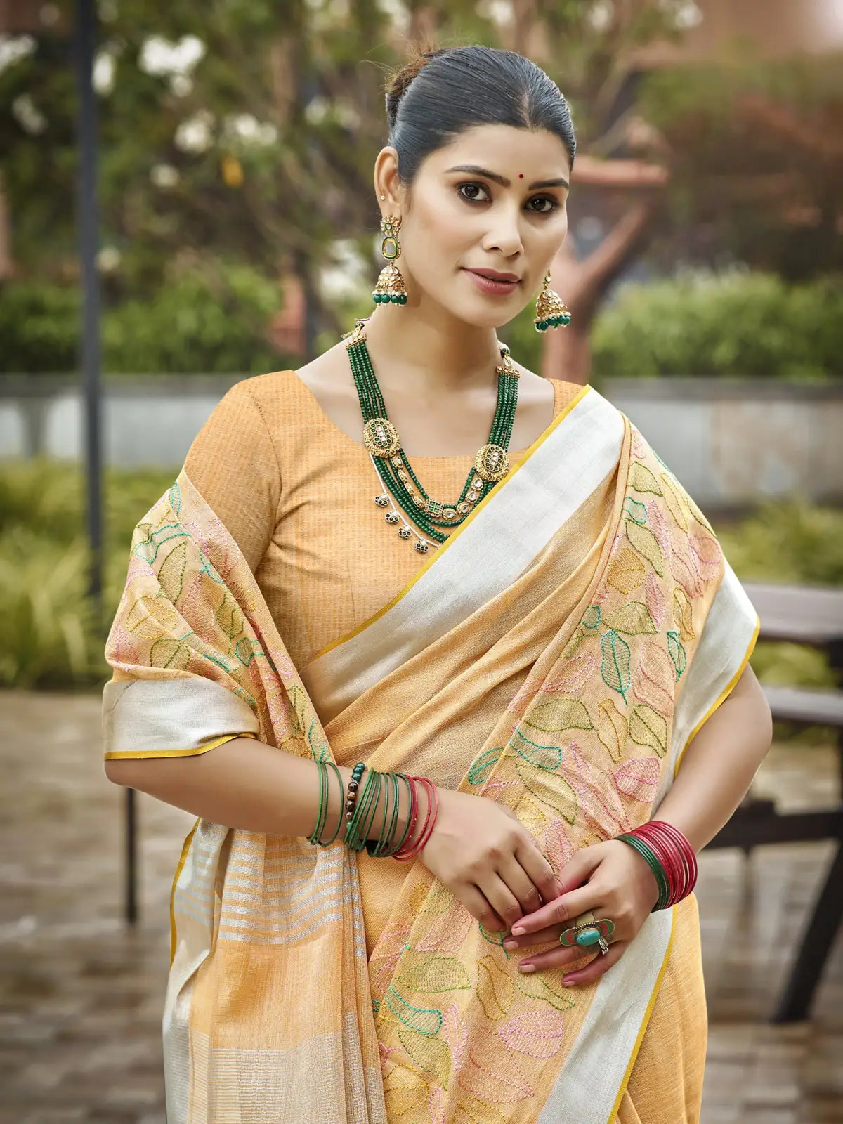 Tarani yellow linen saree upper body view highlighting blouse and jewelry