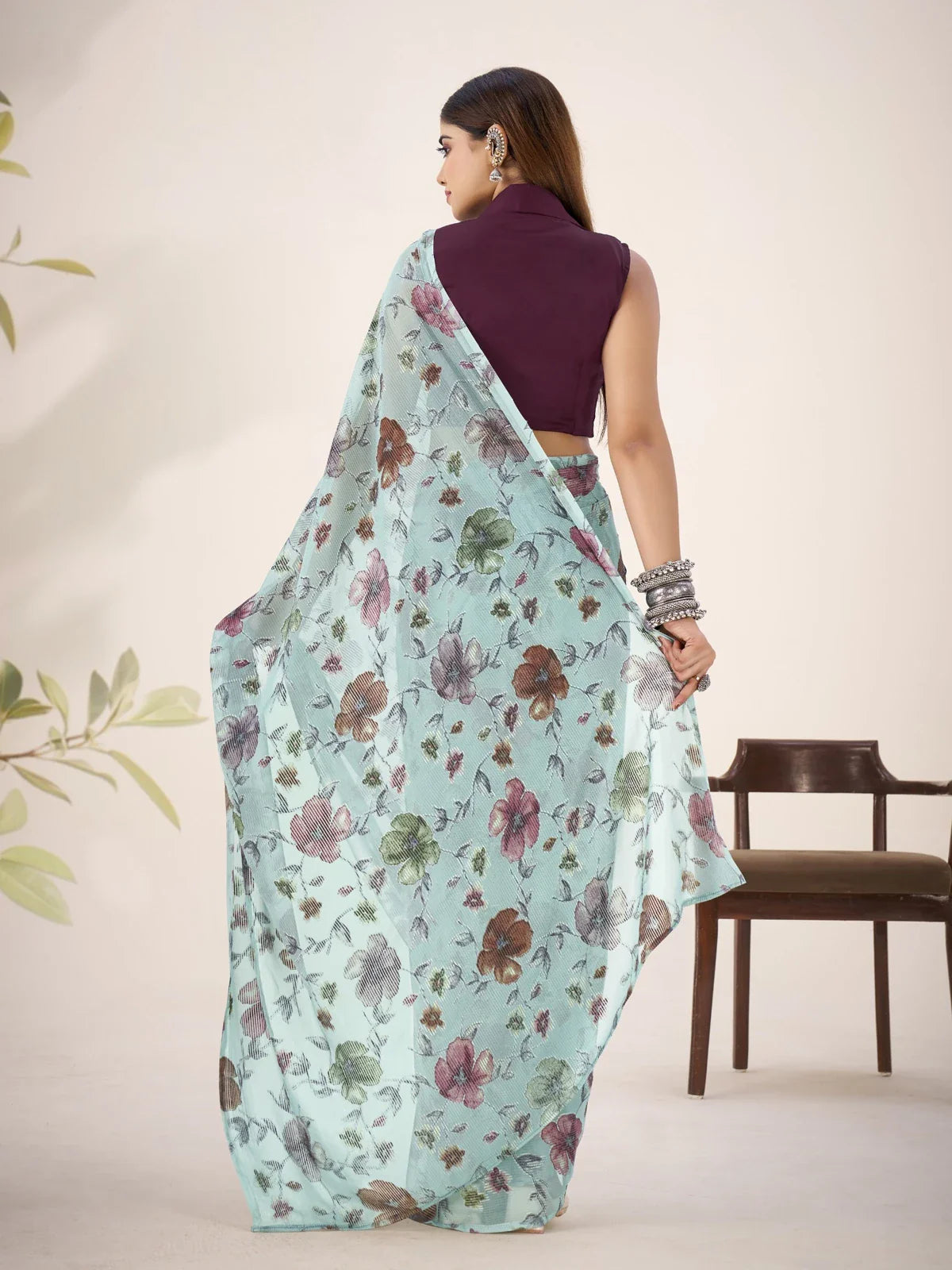 Tarani back view of light blue party wear saree with contrast natural silk blouse