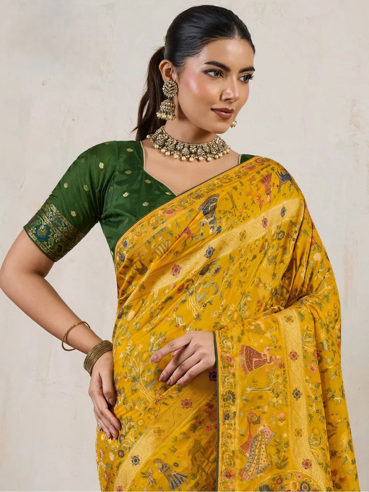 Tarani yellow silk saree closeup upper body view showing blouse and fine zari detailing