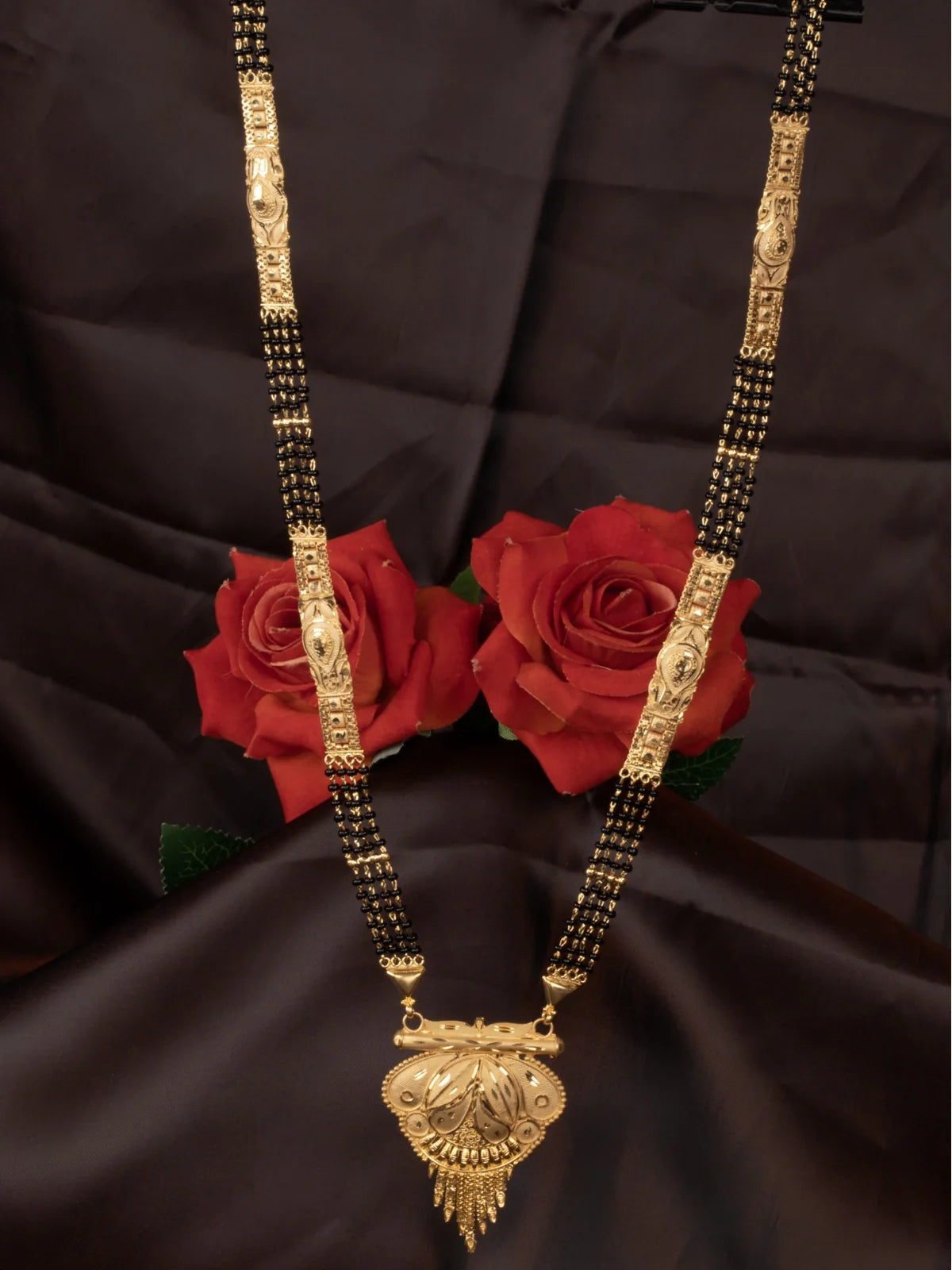 Tarani gold plated mangalsutra with black beads and traditional pendant design for weddings
