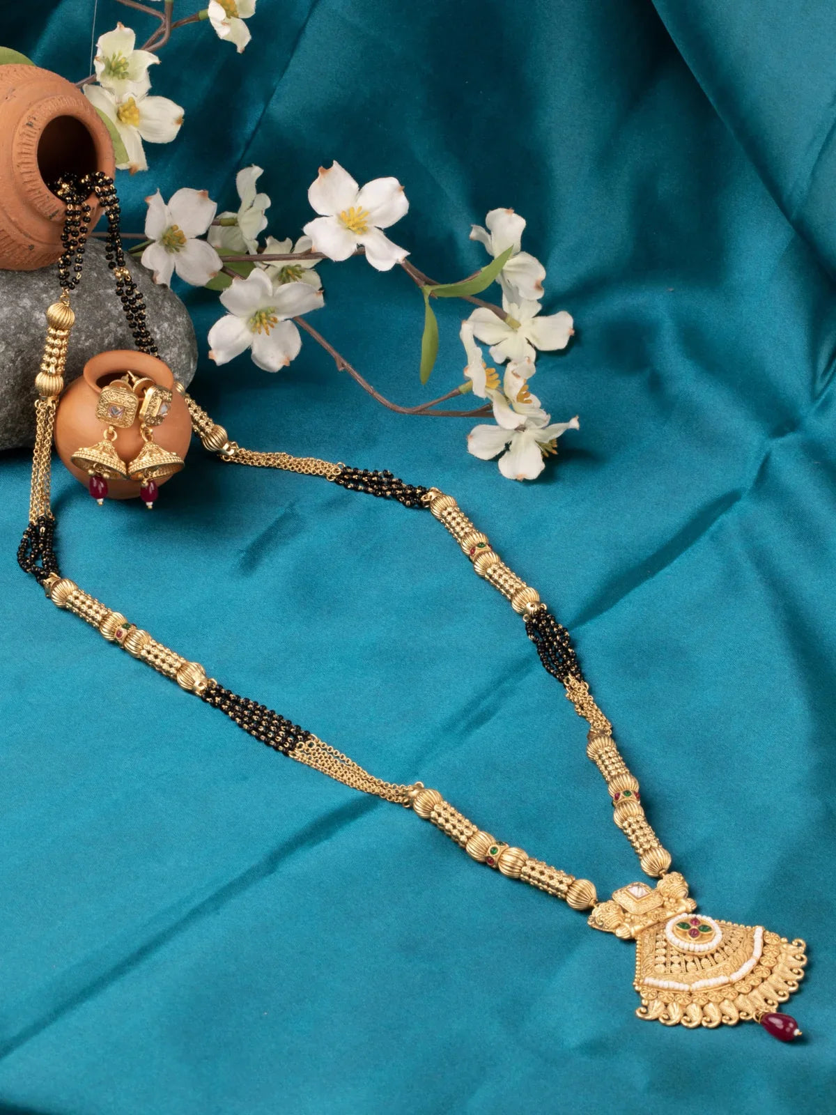 Tarani gold plated mangalsutra with black beads and antique pendant for festive and bridal wear