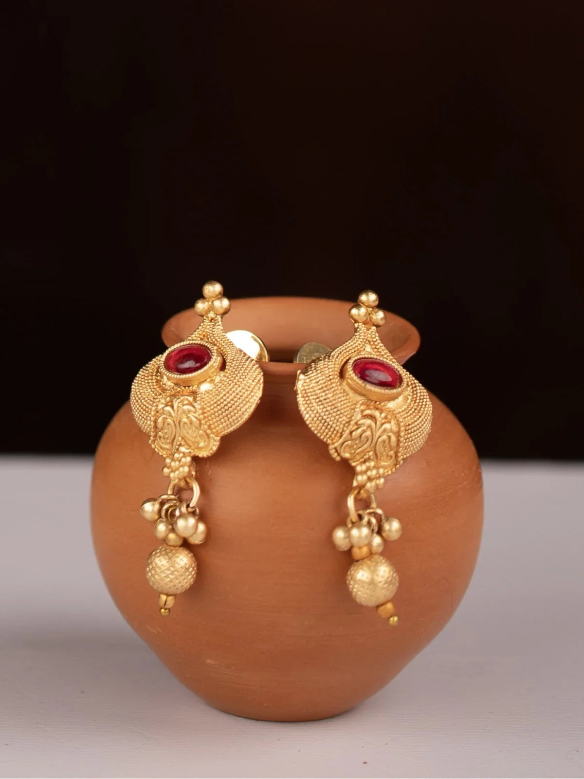 Tarani designer gold plated earrings from mangalsutra set with antique finish