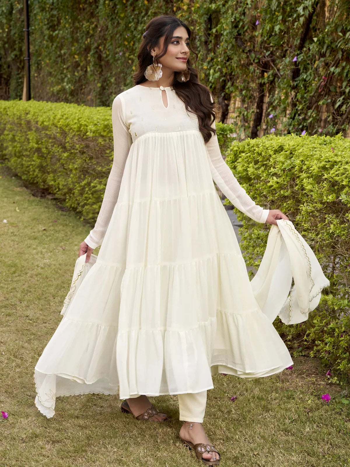 Tarani full length off white marbel Anarkali dress showing side pose with styling details
