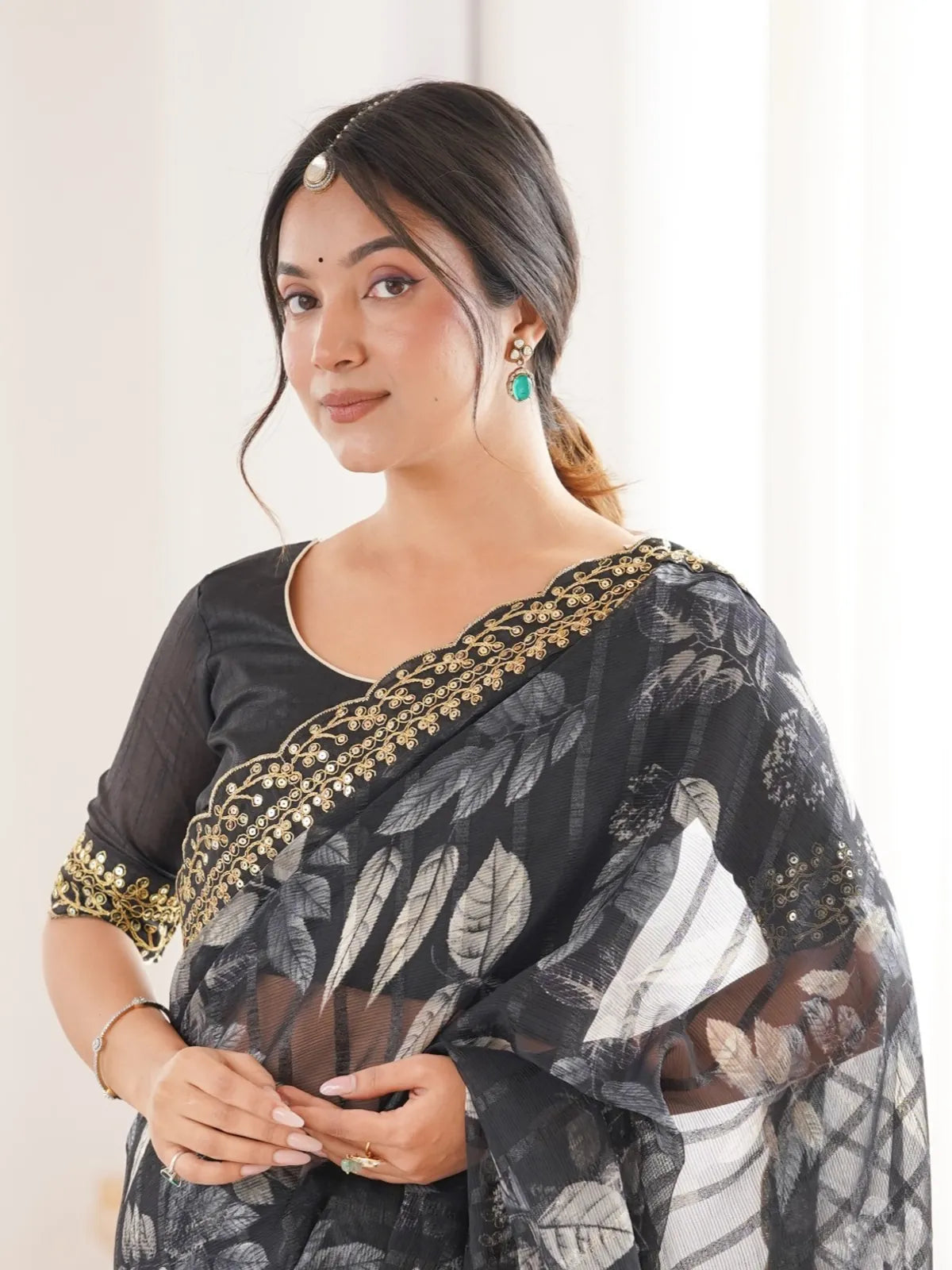 Tarani party wear black saree upper body view with mono bengalori blouse and elegant finish
