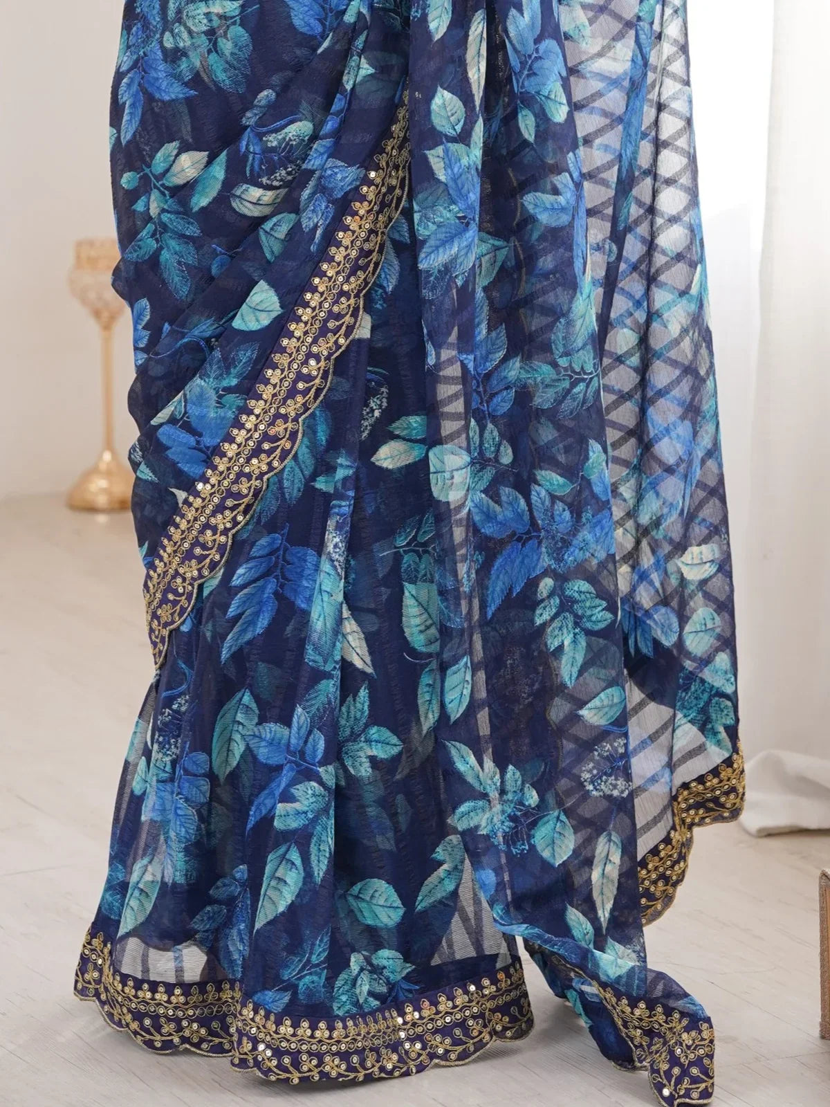 Tarani blue marble saree close-up showing detailed floral print and embroidery