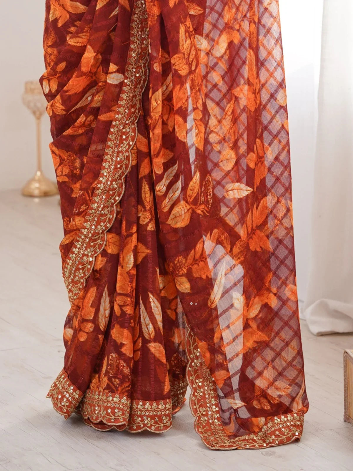 Tarani maroon marble saree closeup with golden embroidery and floral pattern