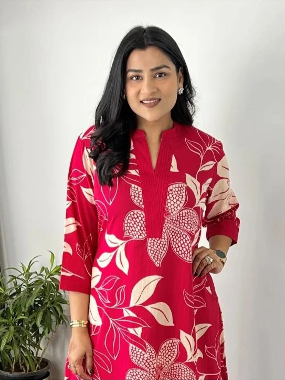 Tarani maslin dress in red showing close-up of neckline and sleeve print