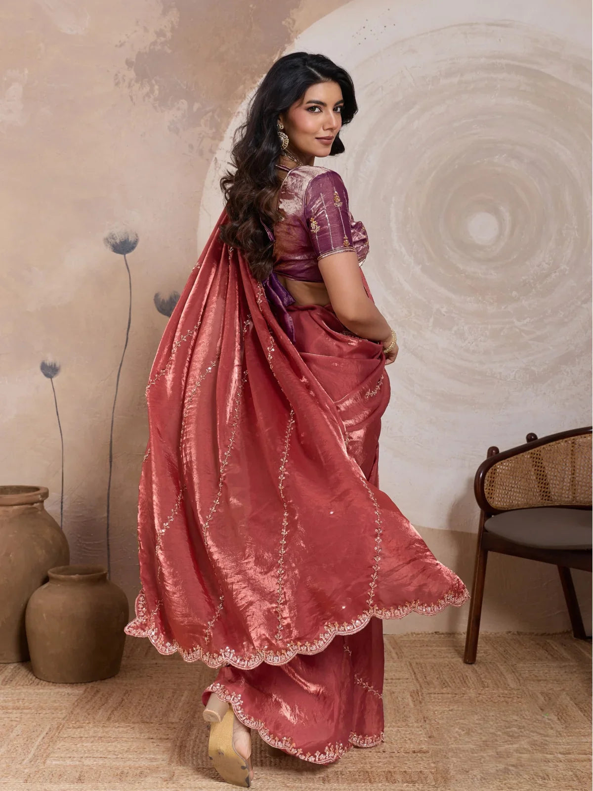Tarani maroon velvet saree back view showing flowy pallu and blouse embroidery for festive occasions