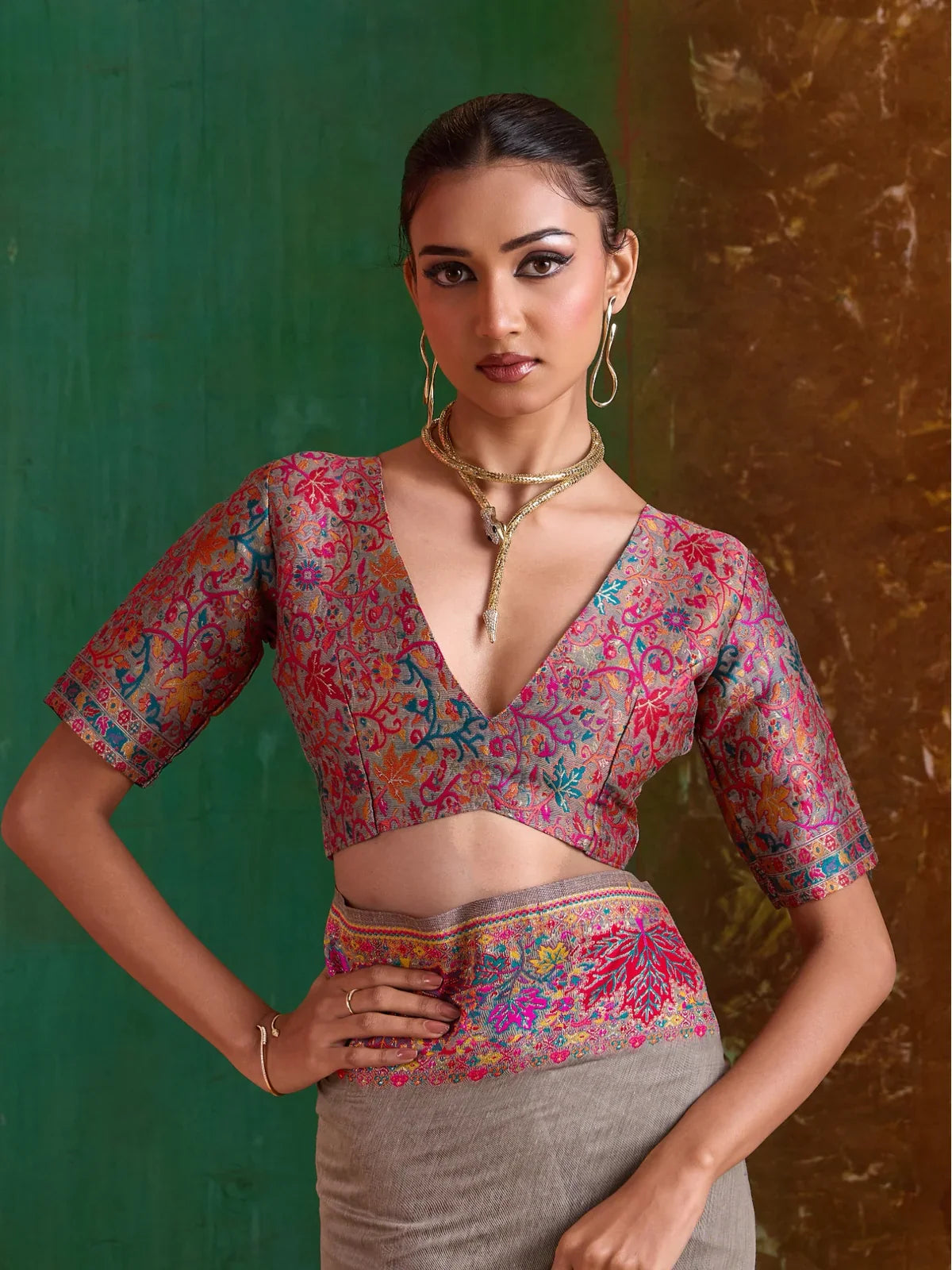 Tarani grey saree close-up of rich pink and teal blouse in upper body pose