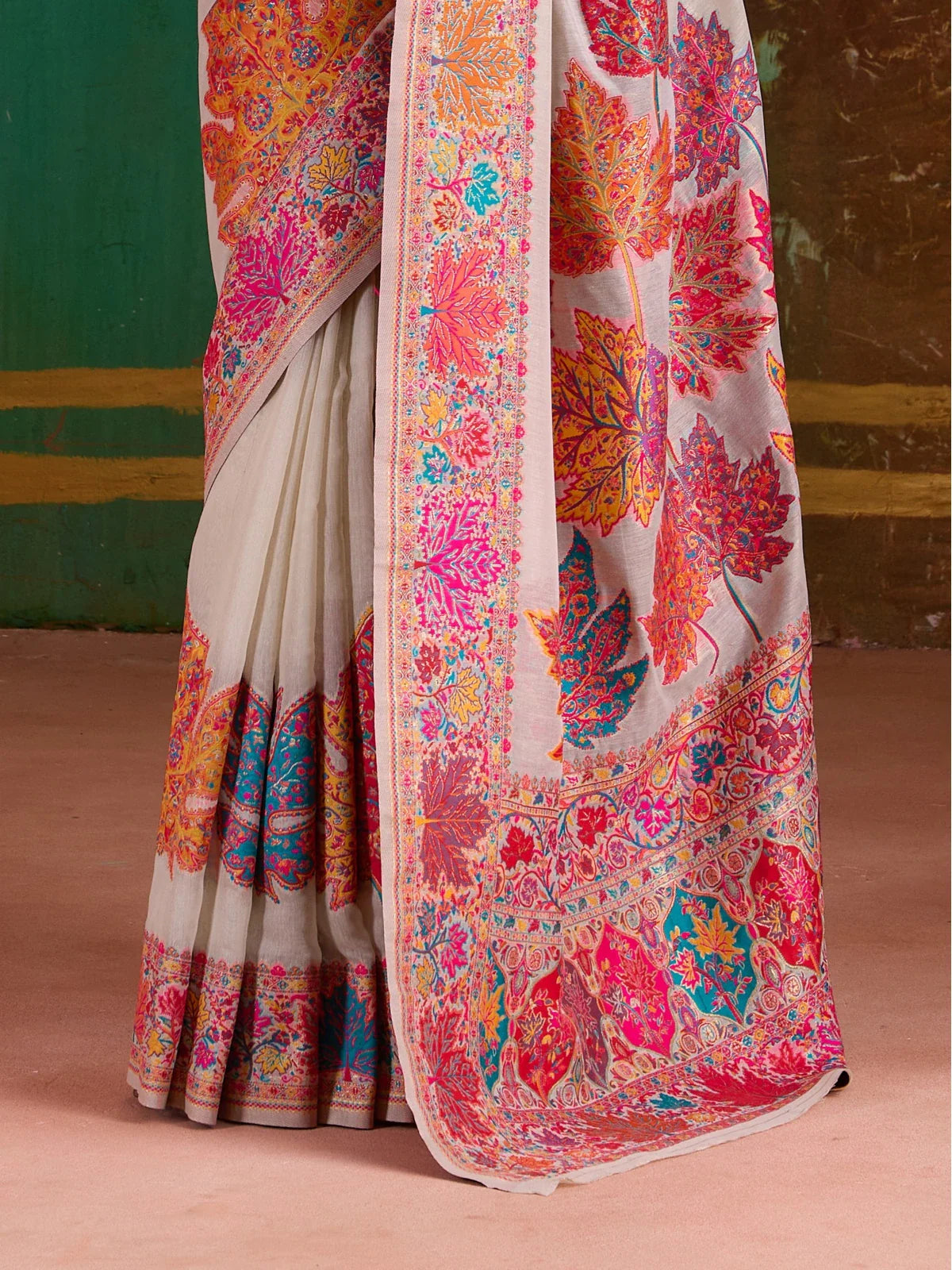 Tarani saree close-up showing border embroidery and pleat detailing