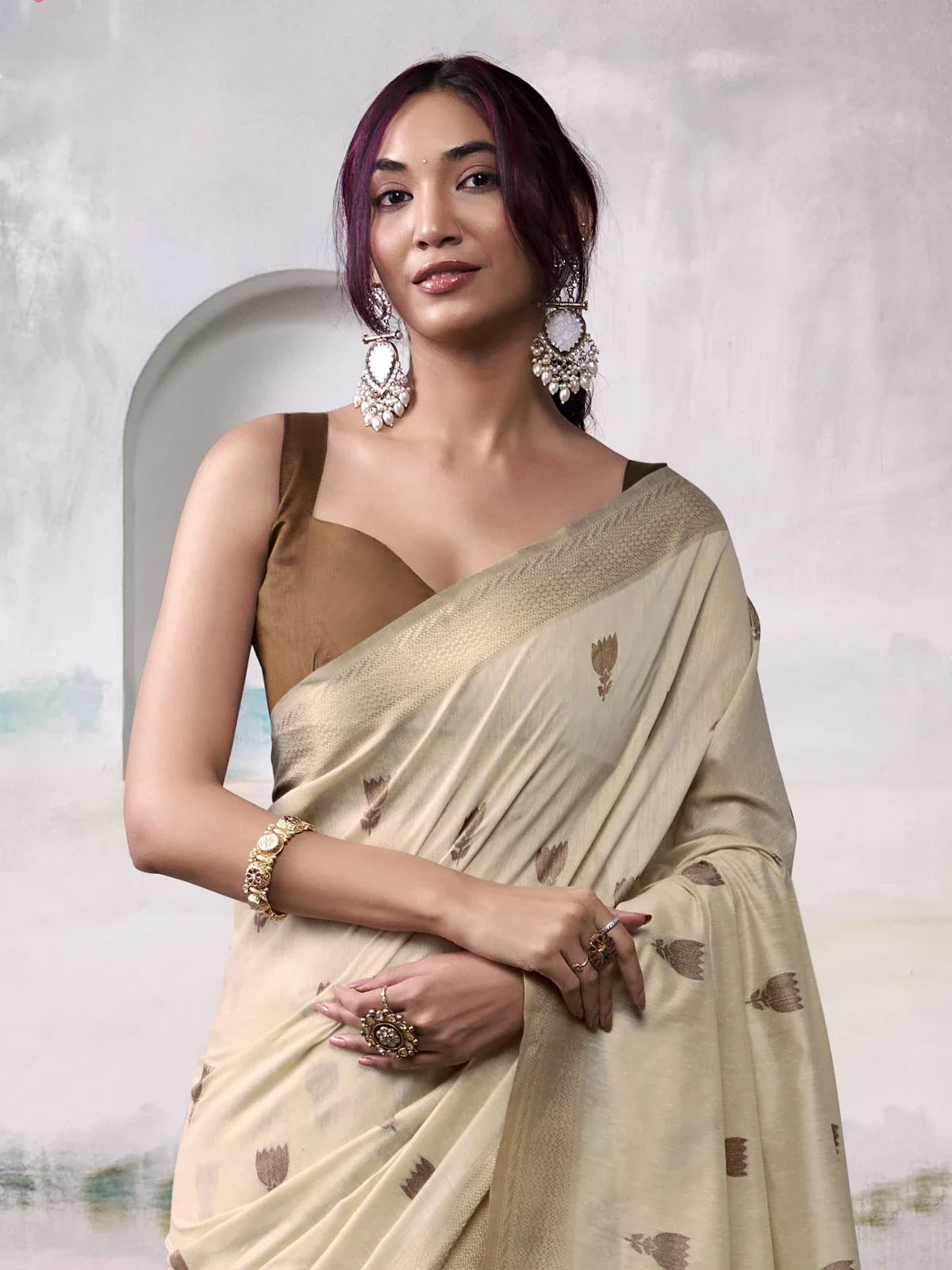 Tarani beige modal cotton saree showing upper body and intricate weaving details