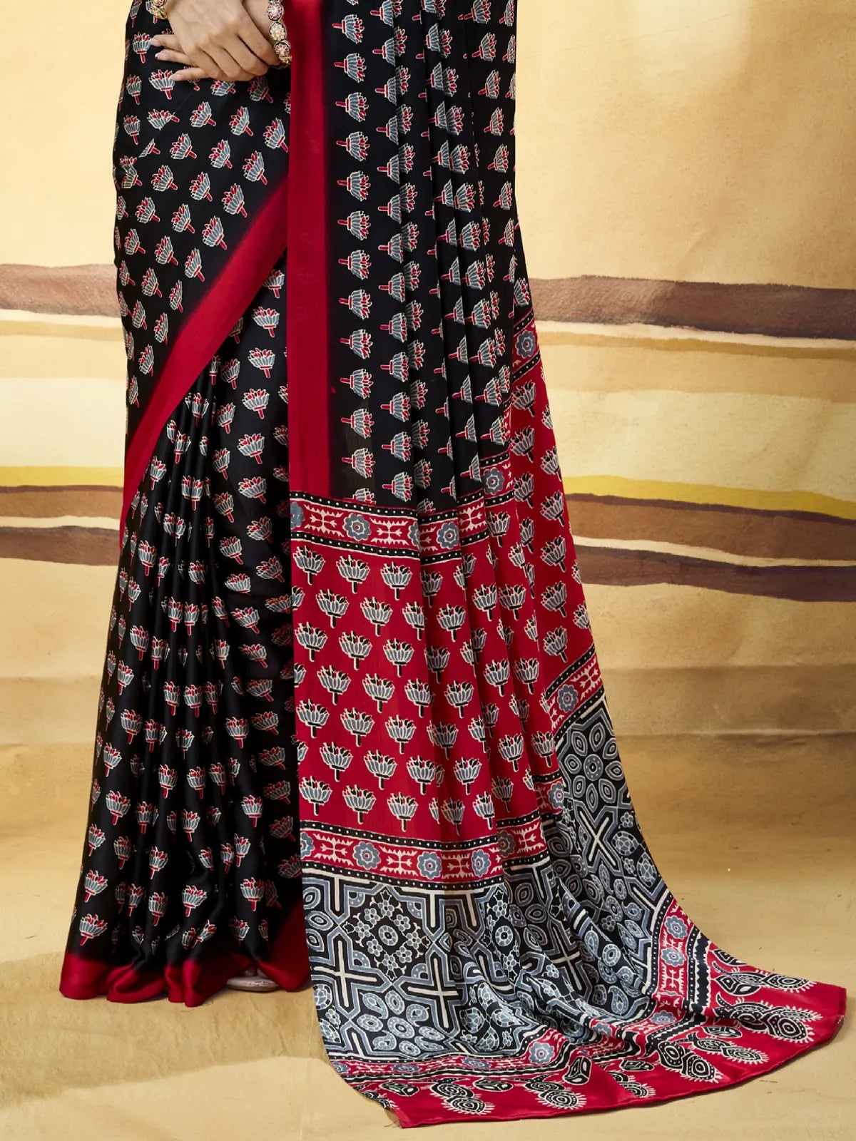 Tarani black Modal Satin Ajrakh Print saree pallu view with detailed Ajrakh border