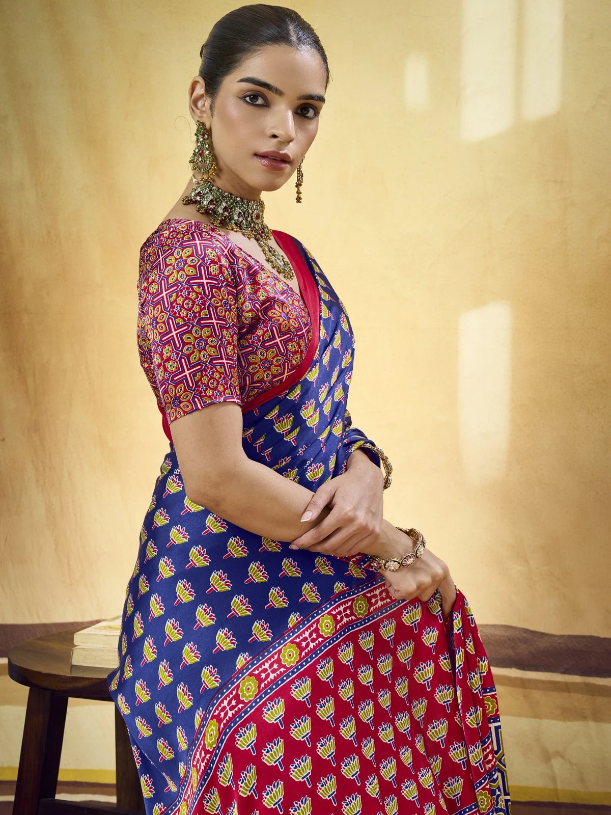 Tarani upper body view of navy blue Modal Satin Ajrakh Print saree and blouse