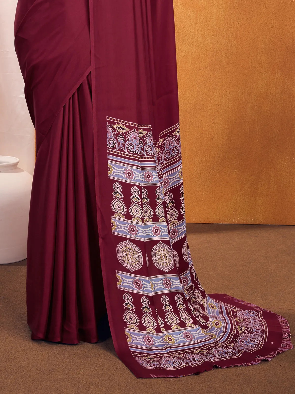 Tarani maroon saree pallu view highlighting Ajrakh border and traditional motifs