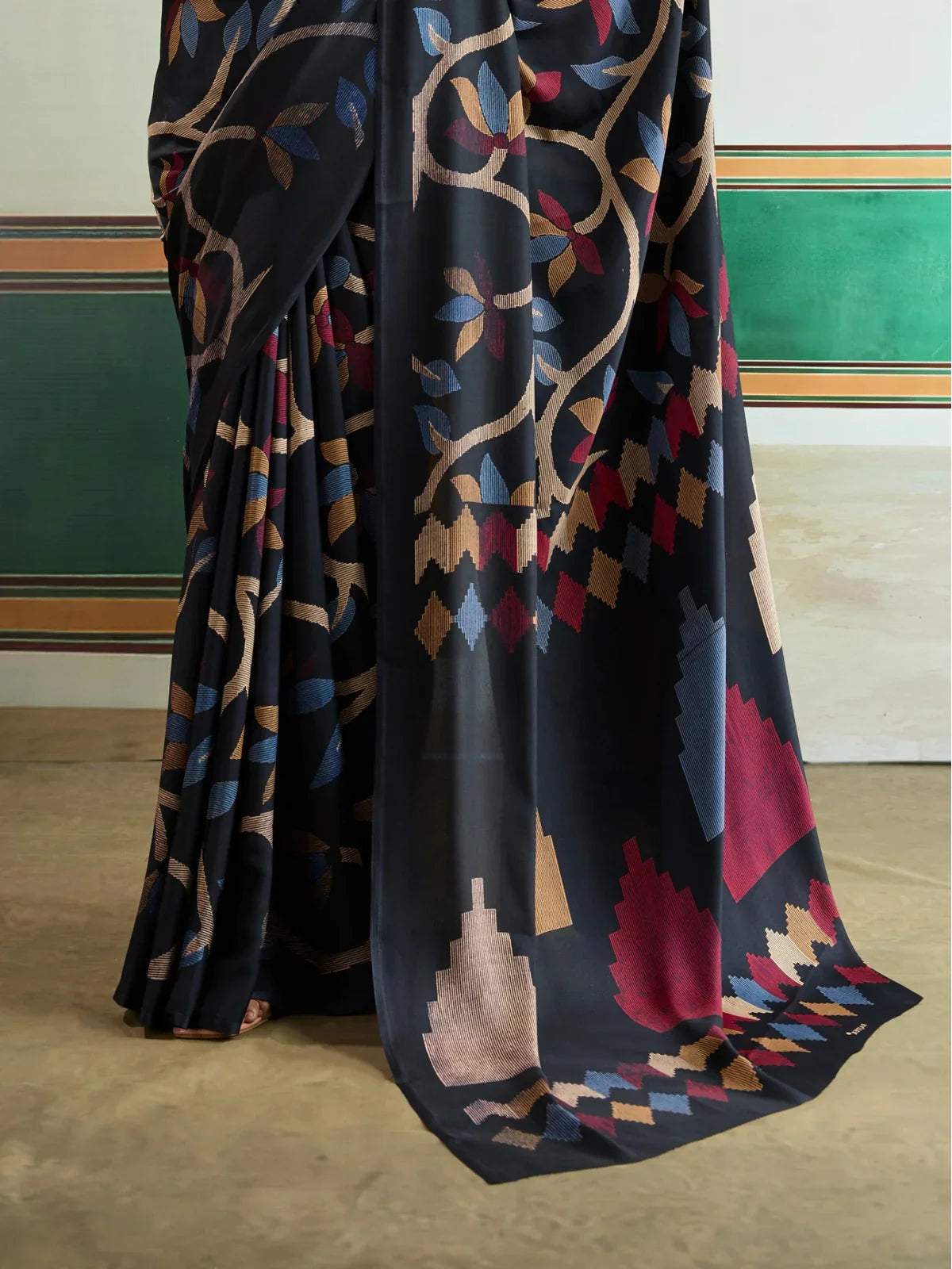 Closeup of Tarani modal satin black saree with geometric Ajrakh motifs and fine detailing