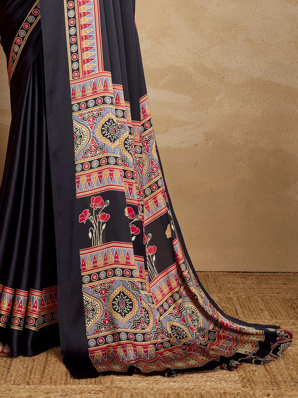 Tarani saree pallu close-up view showing multicolor geometric motifs and floral prints