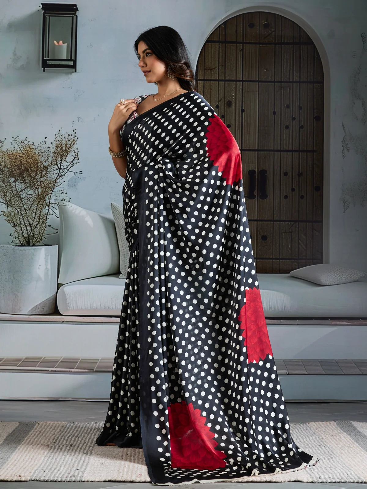 Tarani black modal satin Ajrakh print saree side profile with elegant floral border detailing