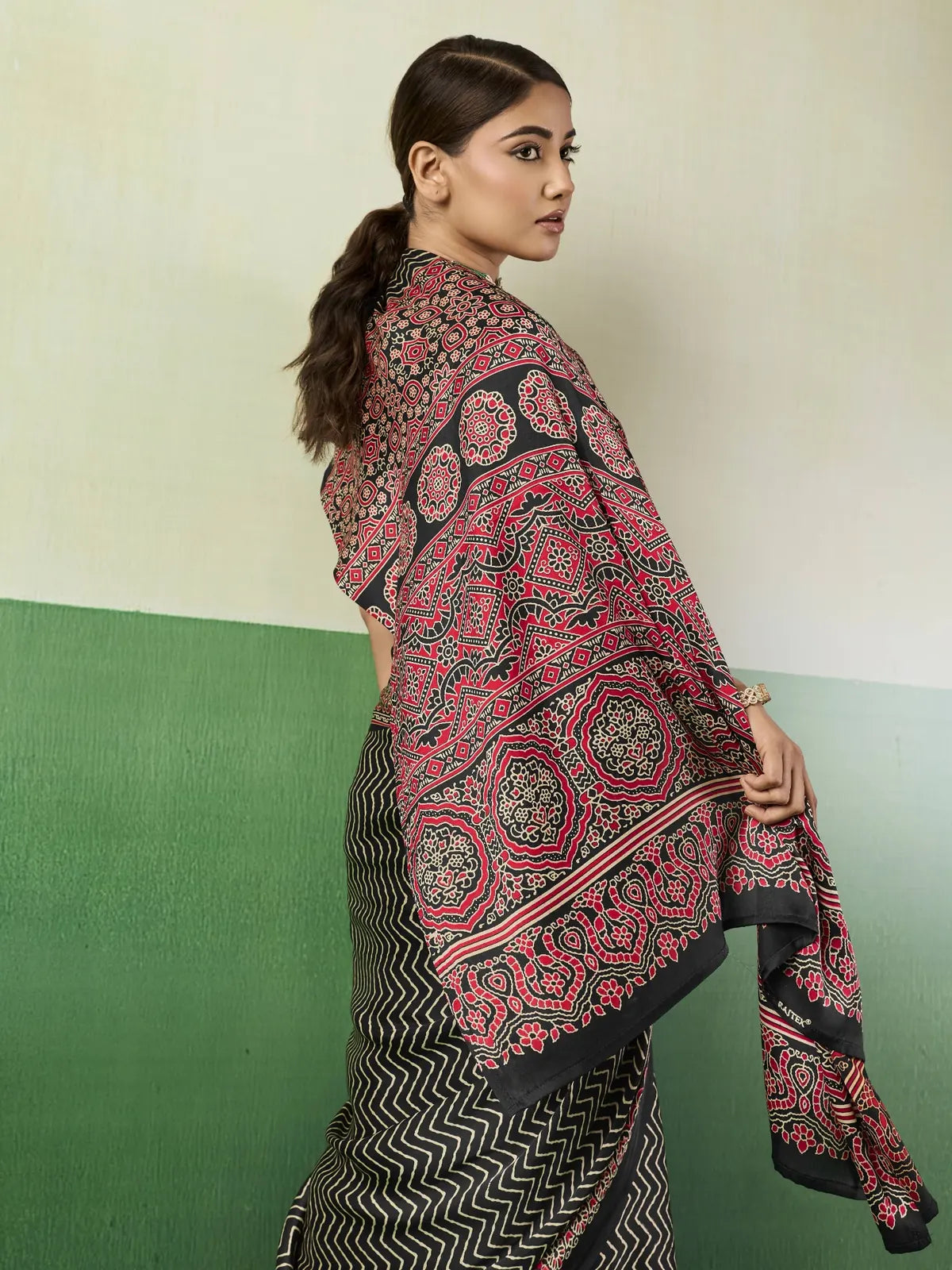 Tarani black modal satin saree side view with elegant Ajrakh print pallu
