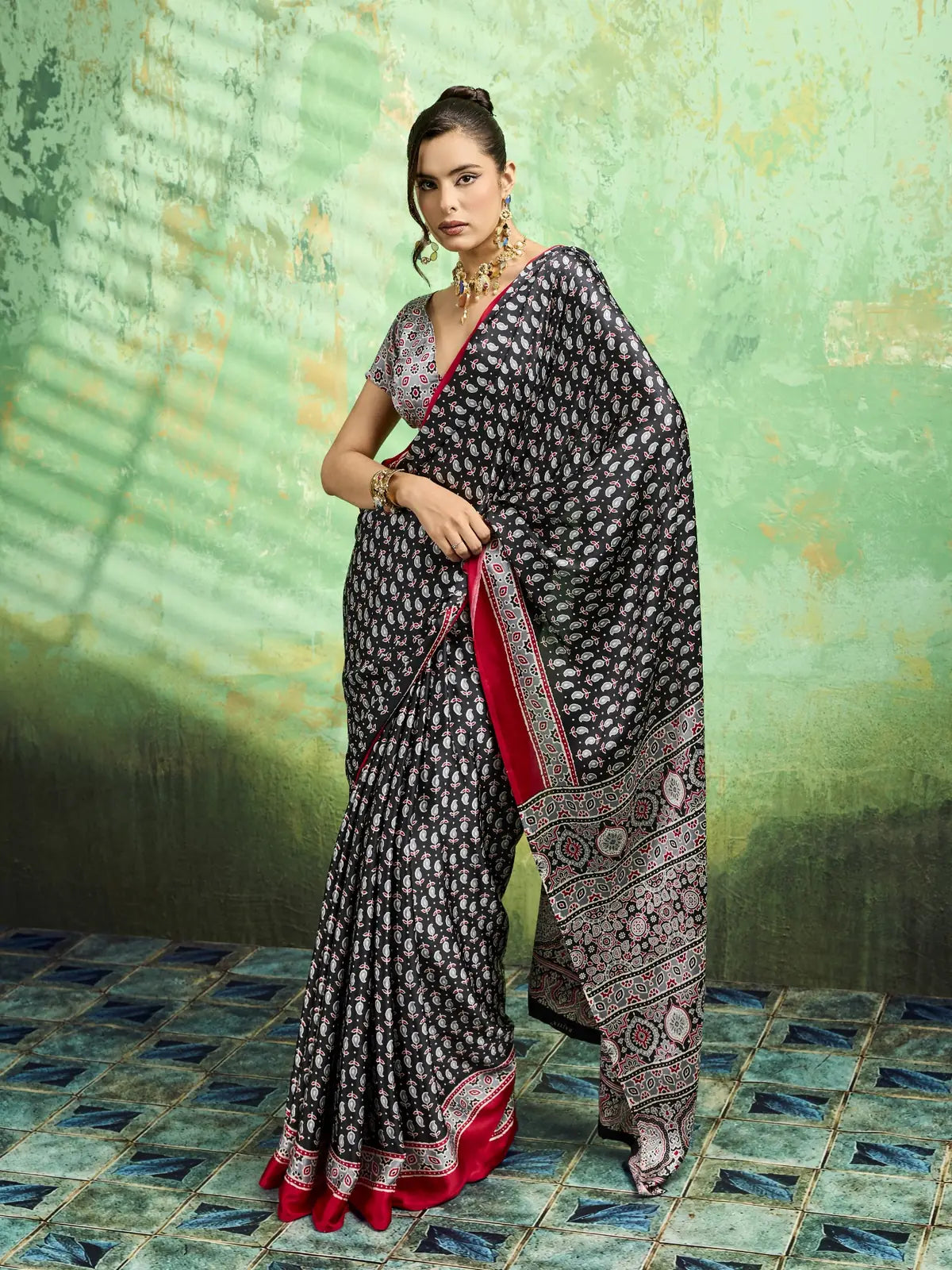 Tarani black modal satin saree side view with Ajrakh print pallu and stylish festive look