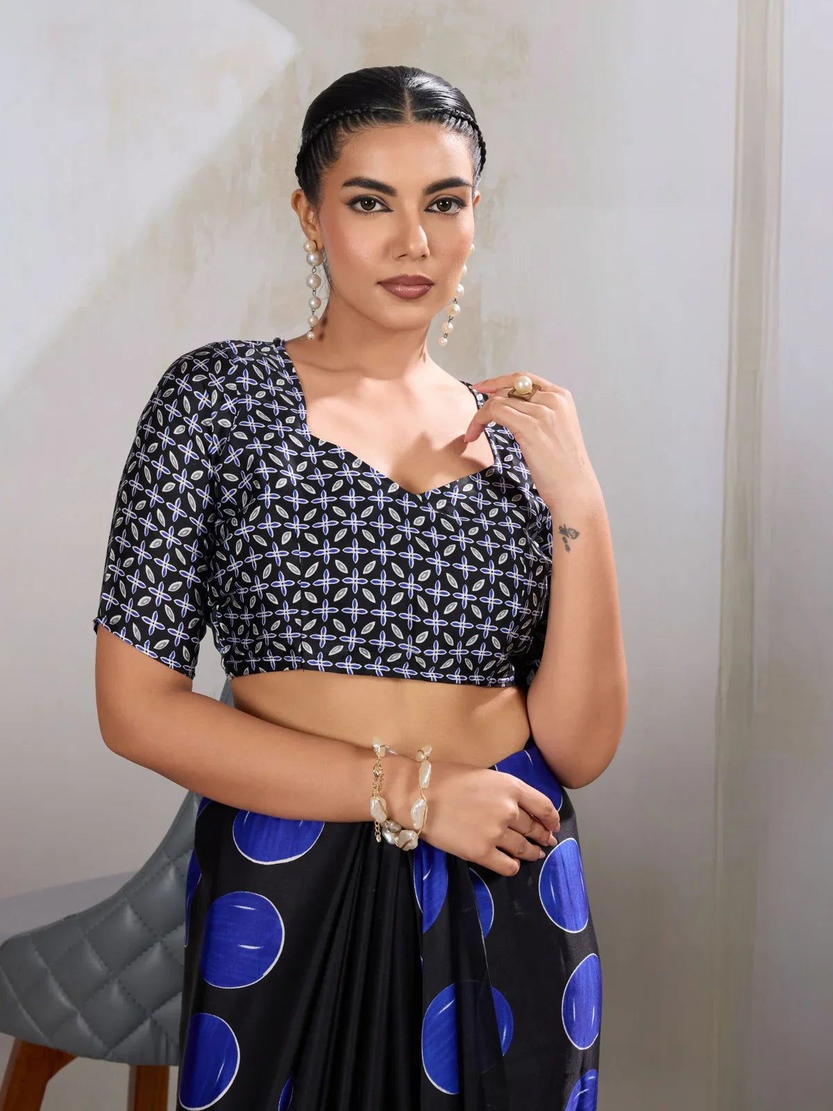 Tarani upper body view showing model wearing black Ajrakh blouse with bold accessories