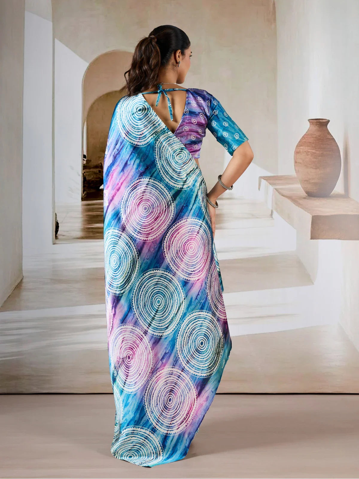 Tarani modal satin saree back view showing circular printed pallu design