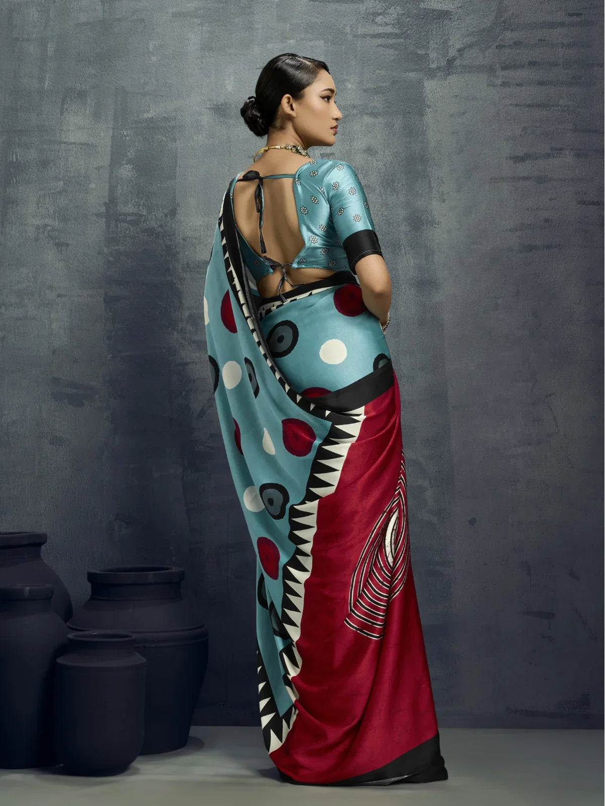 Tarani modal satin saree full back view with deep neckline blouse and modern styling