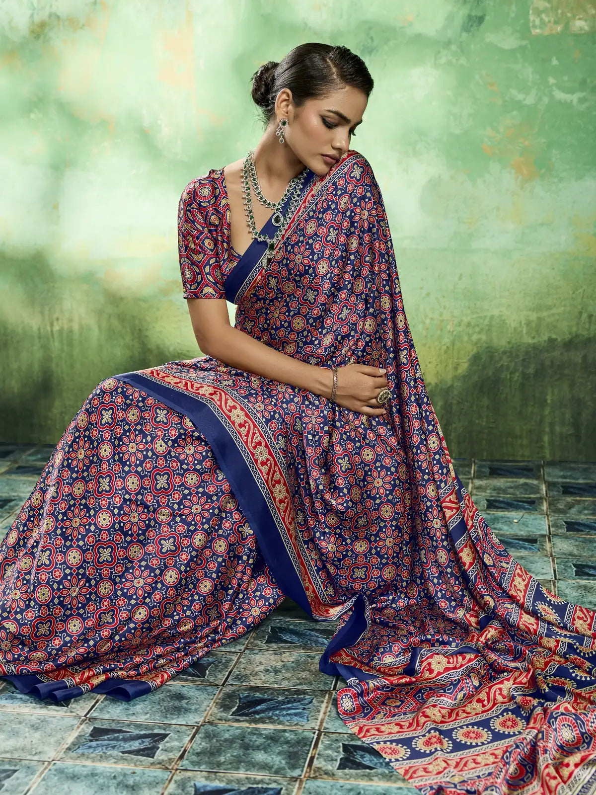 Tarani elegant blue modal satin saree closeup seated pose with Ajrakh print