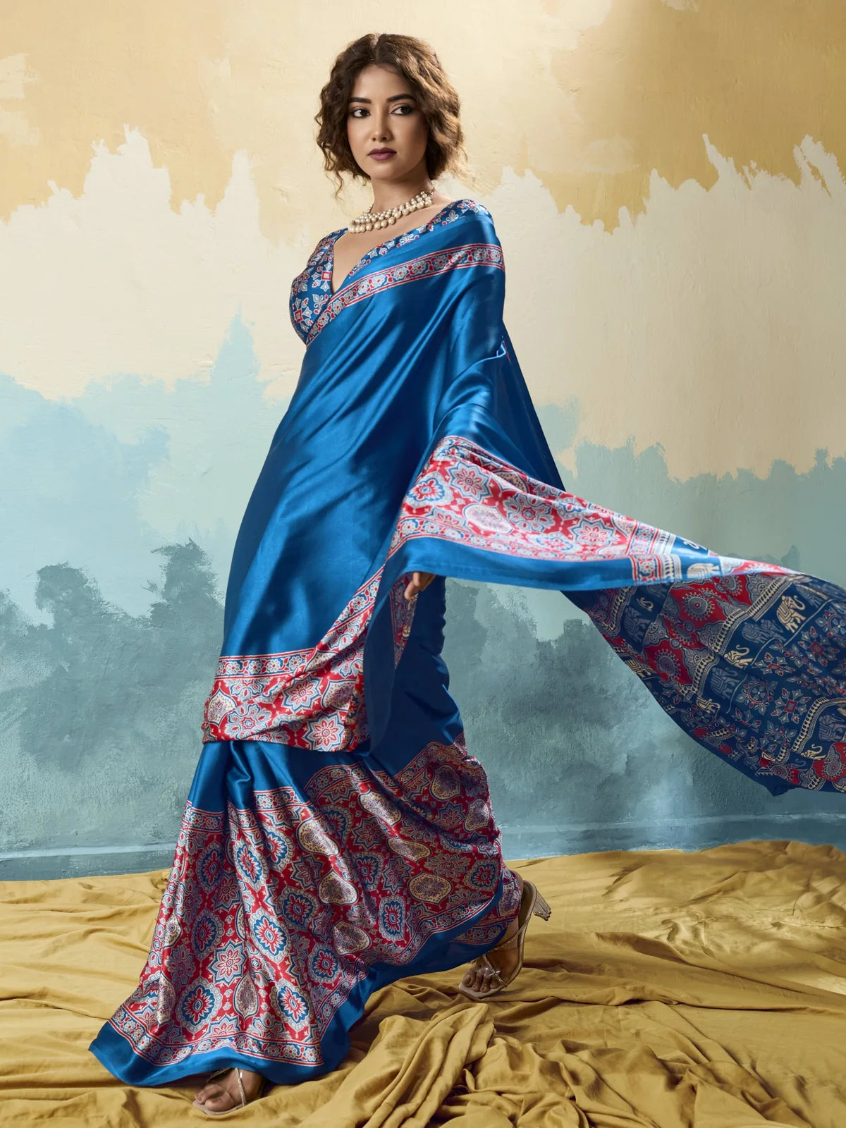 Tarani blue modal satin Ajrakh print saree front view with flowing festive drape styling