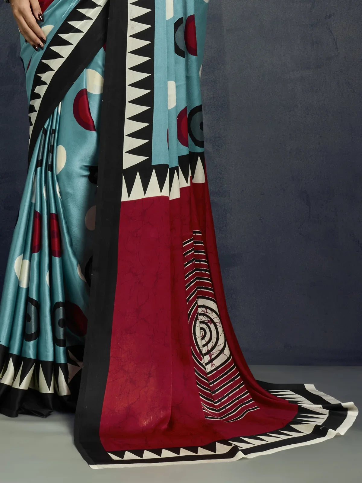 Tarani modal satin saree red pallu with tribal concentric circles and graphic border design