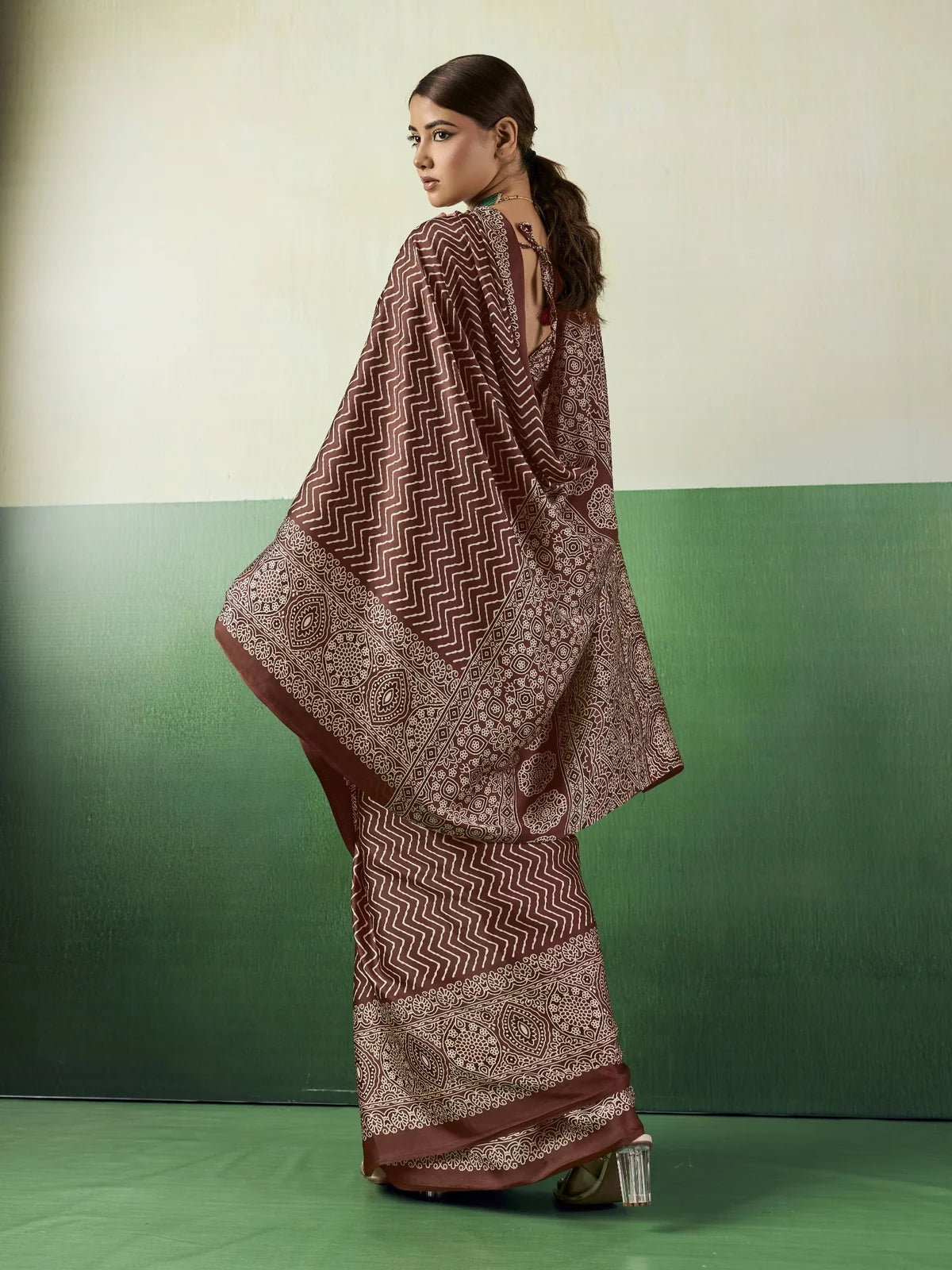 Tarani brown modal satin Ajrakh print saree back view showing pallu and blouse back pattern