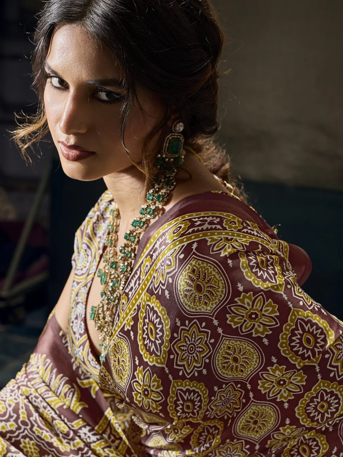Tarani Aishwika brown Modal Satin Ajrakh print saree closeup showing detailed motifs and border