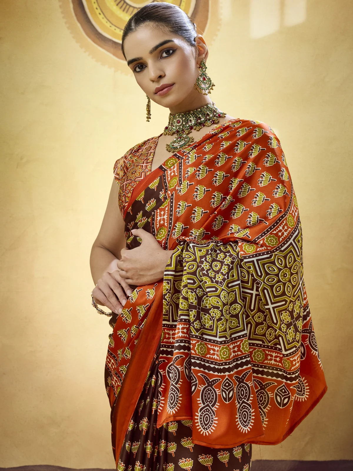 Tarani brown Modal Satin Ajrakh Print saree upper body view highlighting blouse and border