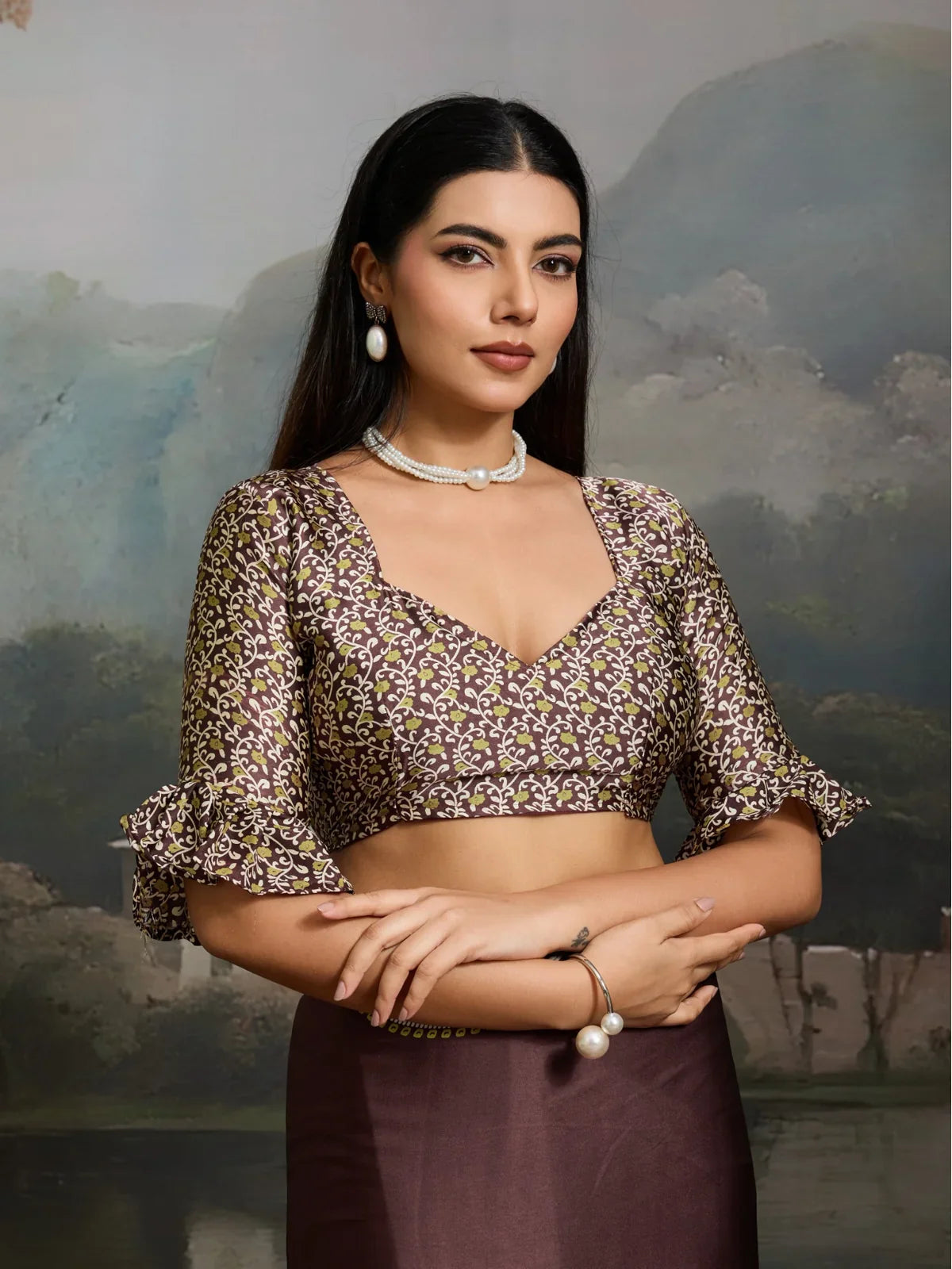 Tarani closeup of modal satin brown saree blouse with floral ajrakh print and pearl accessories