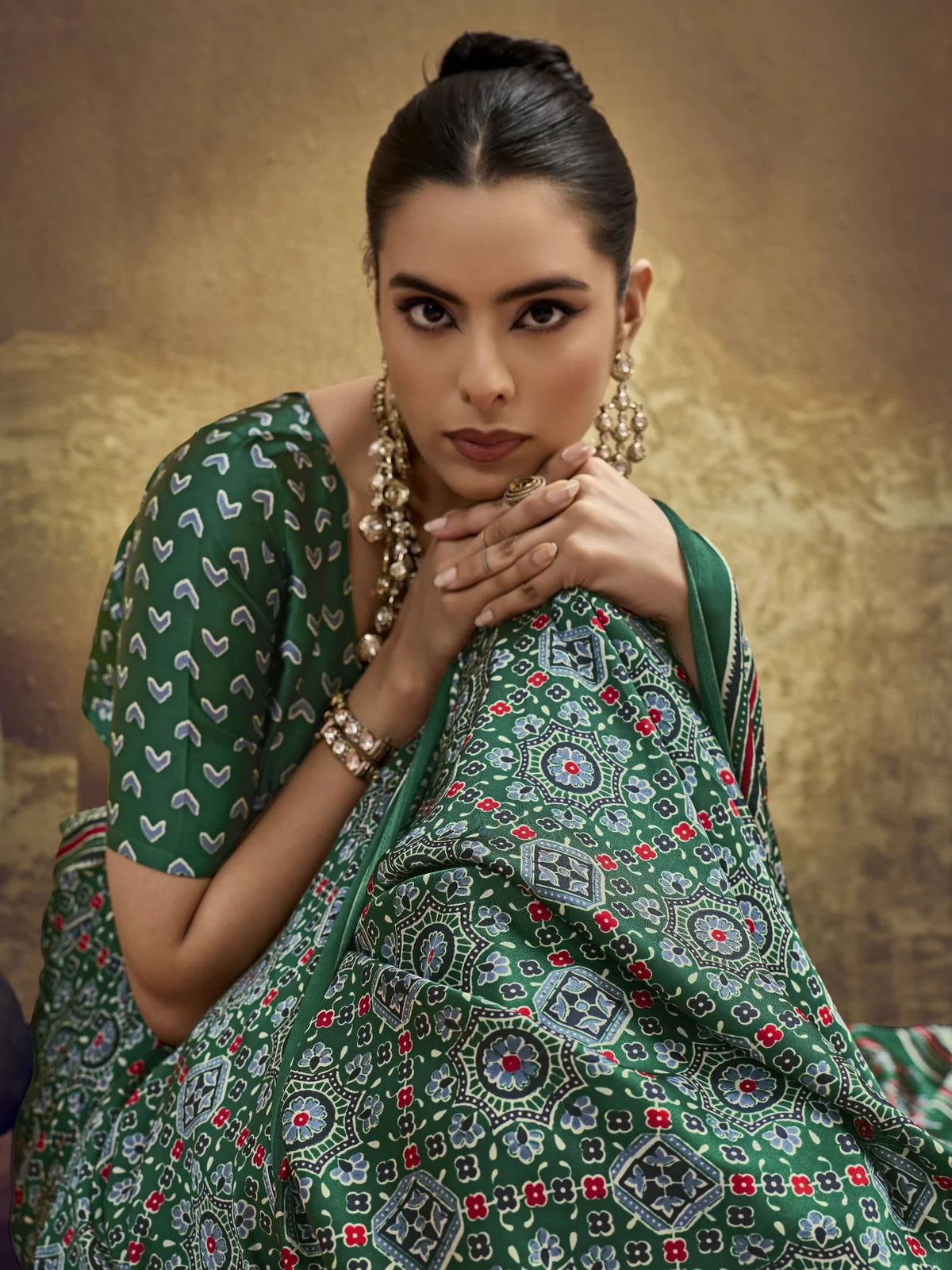 Tarani green modal satin Ajrakh print saree closeup view with intricate floral Ajrakh detailing